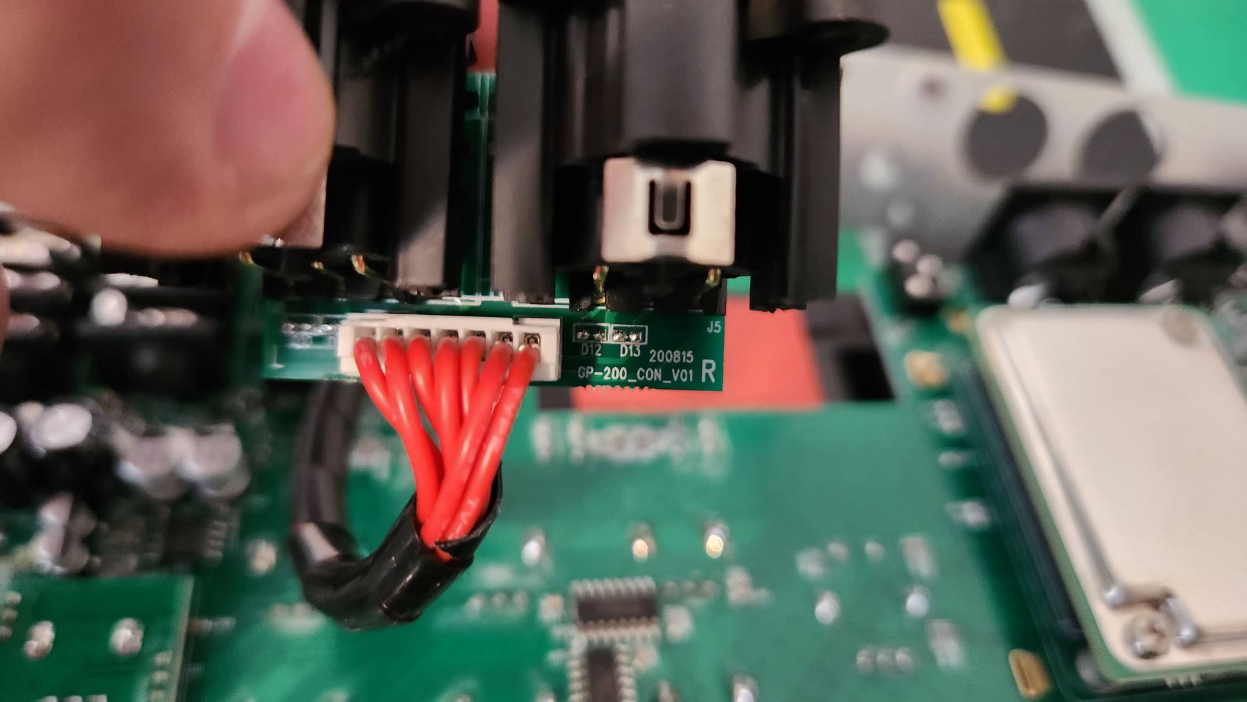 Angled view of the balanced XLR output board and its chassis grounding clips