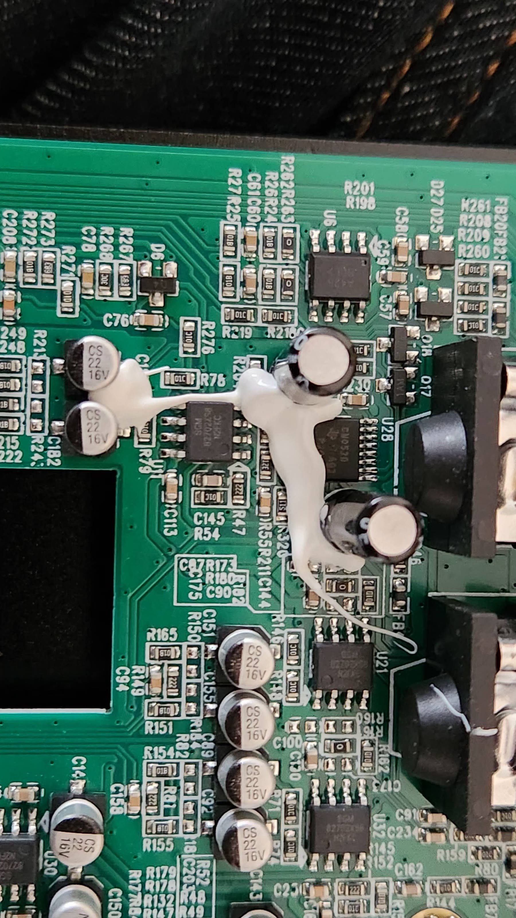 Fully disassembled Valeton GP-200 with chassis parts, circuit boards, and hardware laid out