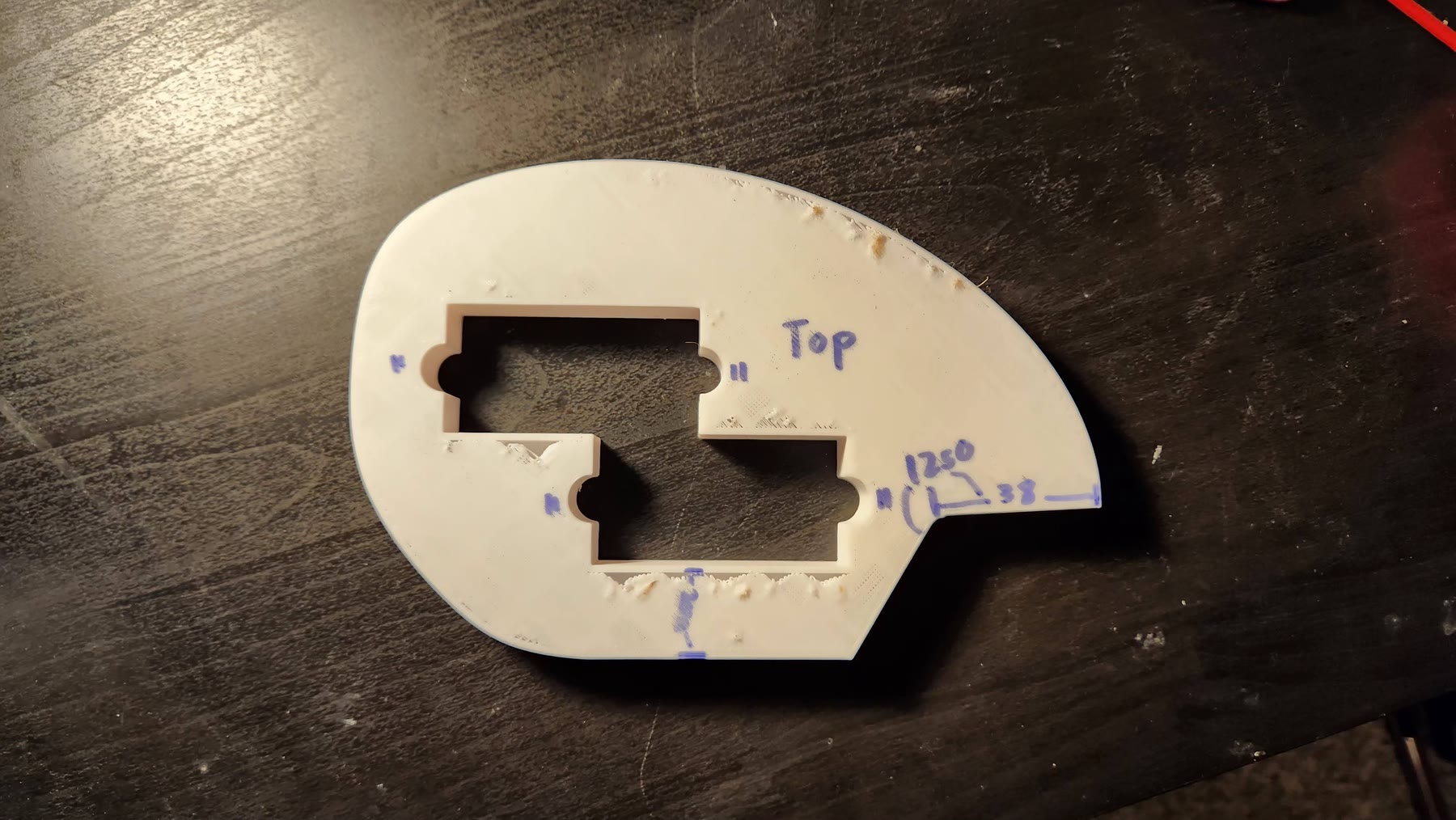 MDF routing template clamped to a pearloid pickguard blank